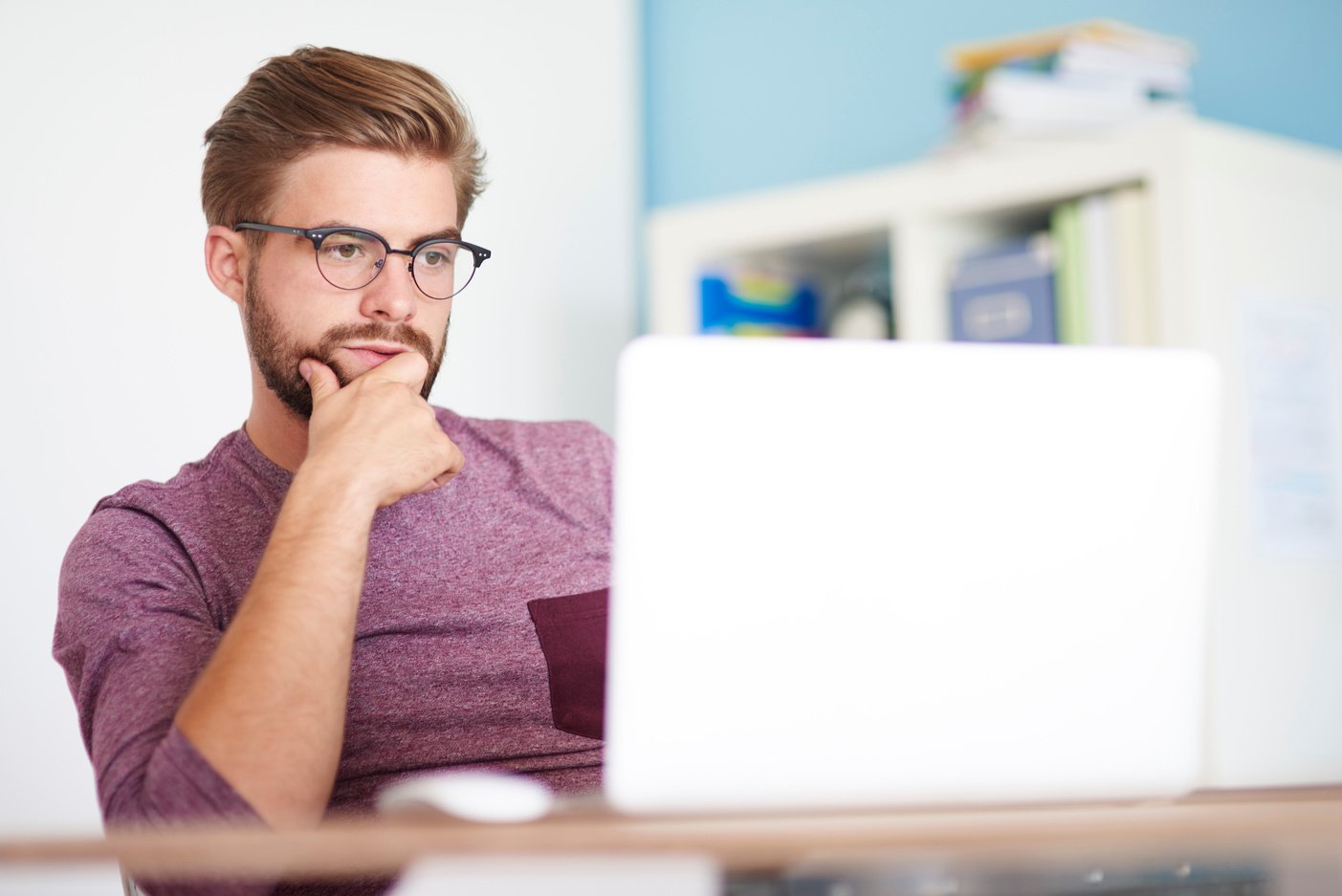 Thoughtful man in front of computer