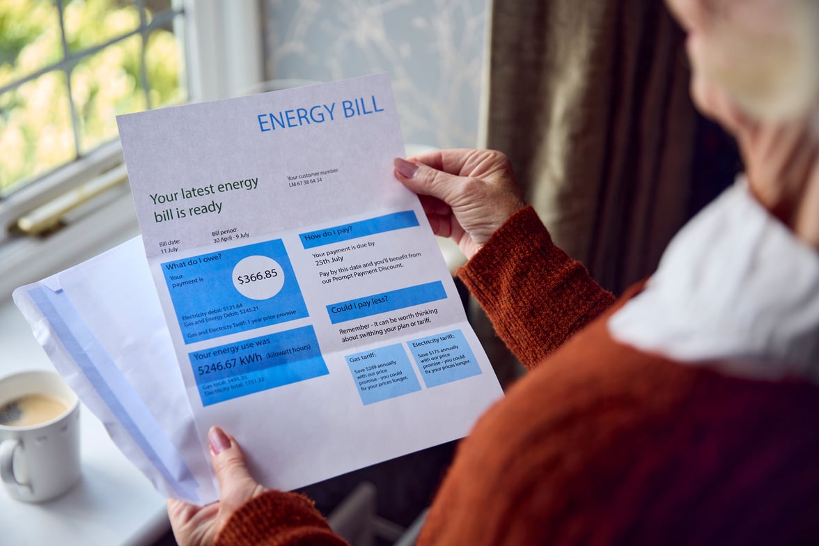 Close up of Senior Woman Opening UK Energy Bill Concerned about Cost of Living Energy Crisis